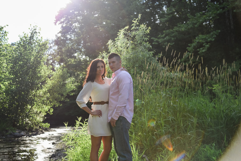 couple by a stream