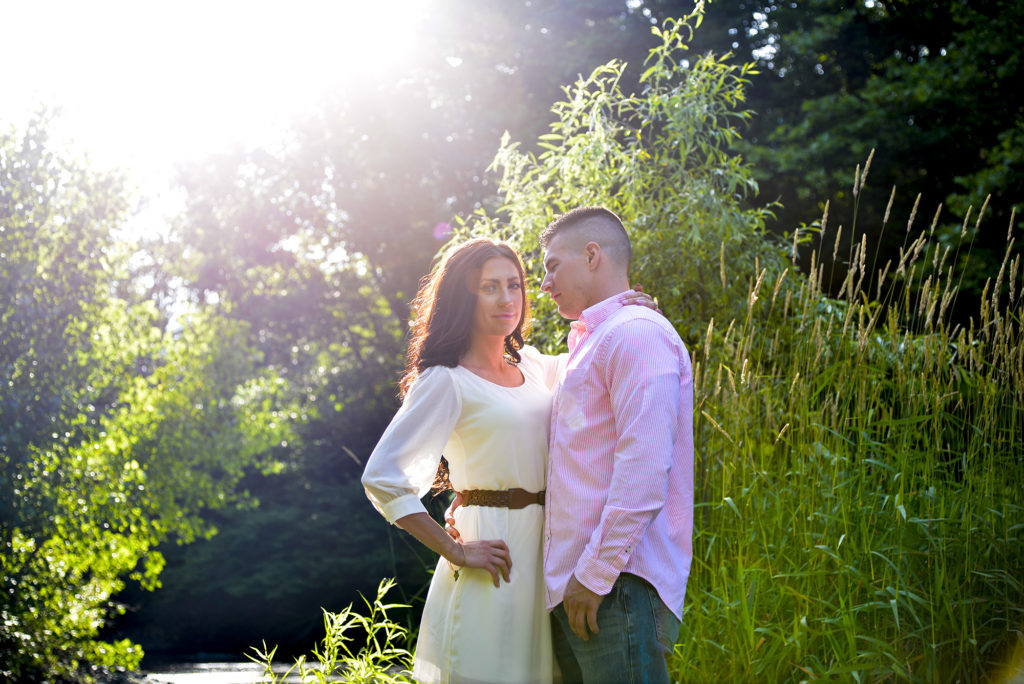 couple by a stream