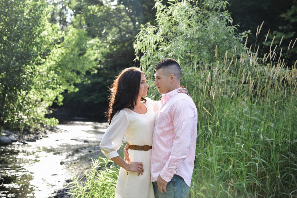 Couple by a stream