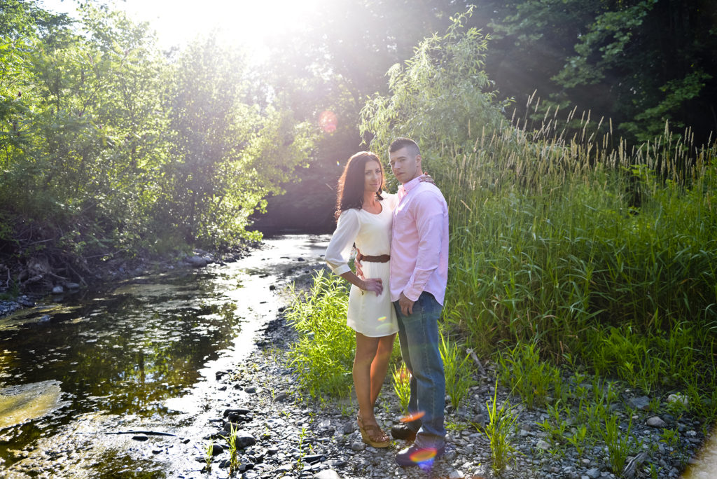 Couple by a stream